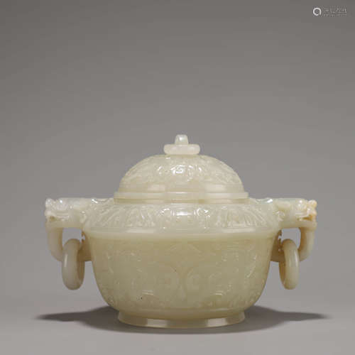 A Chinese White Jade Dragon and Beast Censer and Cover