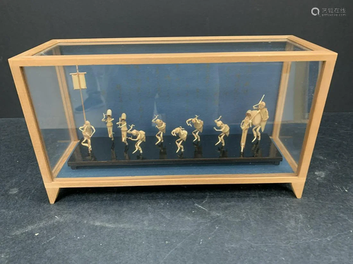 Bamboo carved group of a band in a glass box