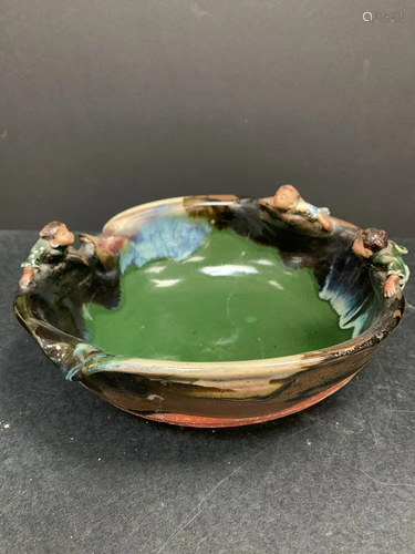 Japanese handmade bowl with figurines around