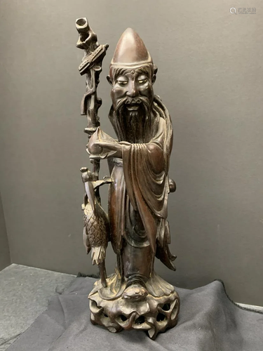 Wood carving of an old man and bird