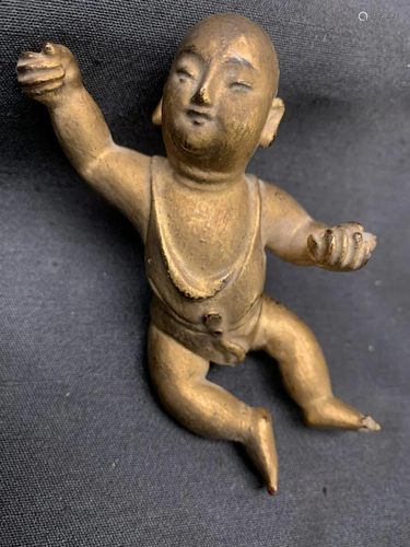 Wood carving of a boy