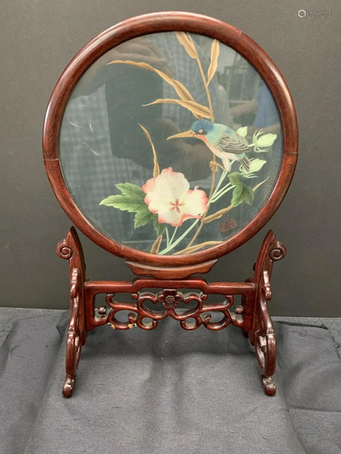 Embroidery on a rosewood stand