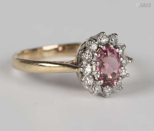 A 9ct gold, pink tourmaline and diamond oval cluster ring, c...