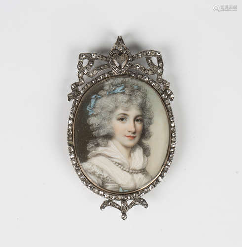 A diamond set oval portrait miniature pendant in the Georgia...