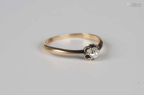 A gold ring, claw set with a cushion cut diamond, detailed '...