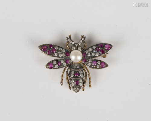 A ruby, diamond and cultured pearl brooch, designed as a win...