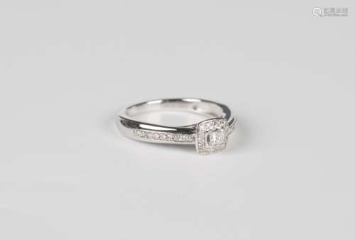 An 18ct white gold and diamond ring, mounted with the princi...