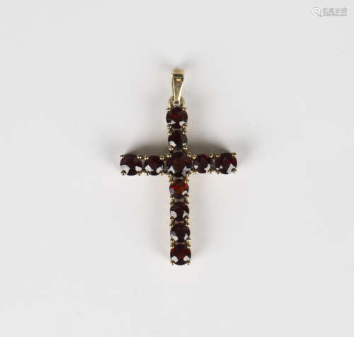 A 9ct gold and garnet pendant cross, mounted with circular c...