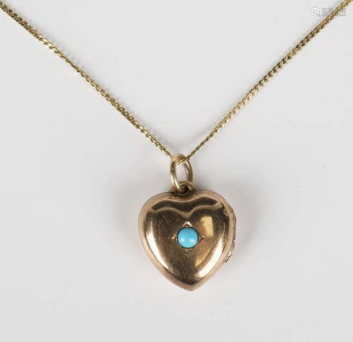 A gold and turquoise heart shaped pendant locket, circa 1910...