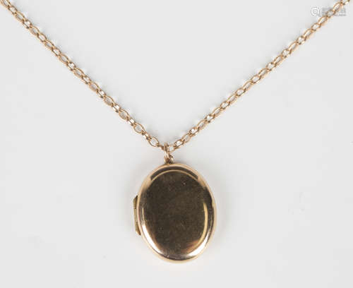 A 9ct gold oval pendant locket, weight 8g, length 3cm, with ...