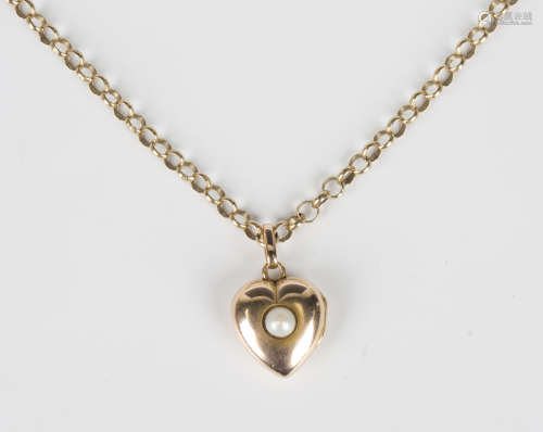 A gold and cultured pearl heart shaped pendant locket, weigh...