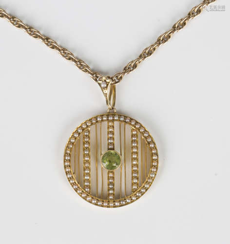 A gold, peridot and seed pearl pendant in a circular banded ...