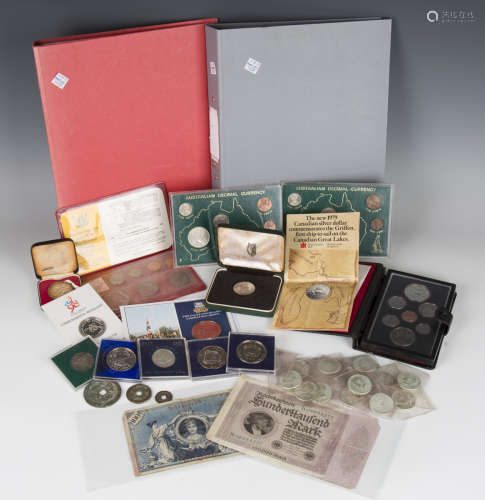 A collection of various world coinage, including seventeen U...