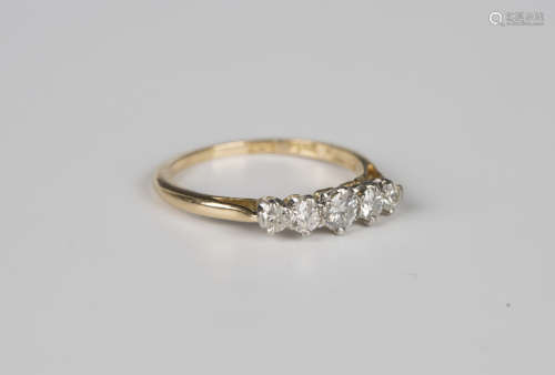 A gold, platinum and diamond five stone ring, claw set with ...