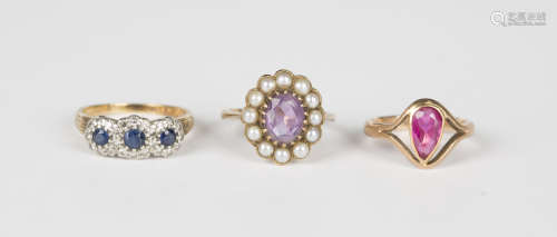 A gold, sapphire and diamond ring in a triple cluster design...