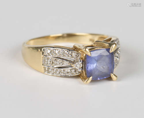 An 18ct gold, tanzanite and diamond ring, claw set with the ...