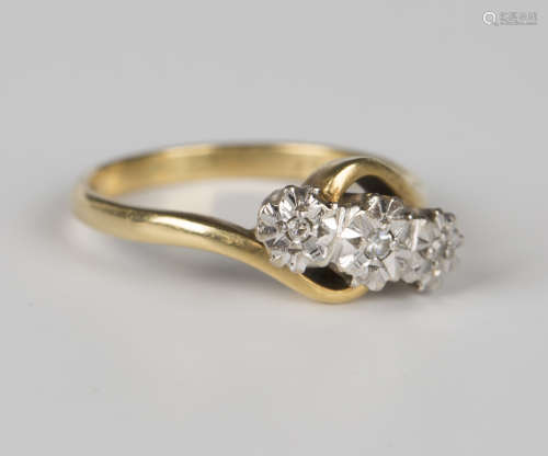 An 18ct gold and diamond three stone ring, mounted with circ...