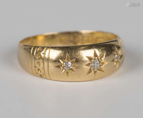 A late Victorian 18ct gold ring, star gypsy set with three c...