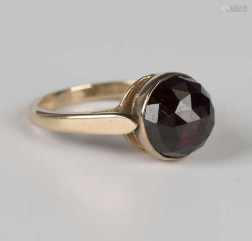 A Bohemian garnet single stone ring, mounted with the facete...