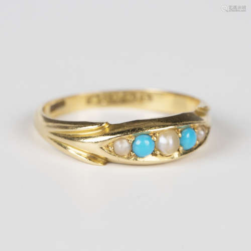 An Edwardian 18ct gold, turquoise and seed pearl ring in a b...