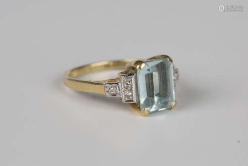 An 18ct gold ring, claw set with a cut cornered rectangular ...