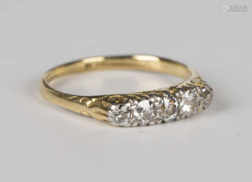 A gold and diamond five stone ring, mounted with a row of cu...