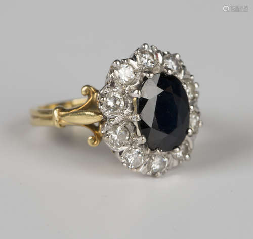 An 18ct gold, sapphire and diamond oval cluster ring, claw s...