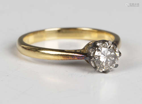 A gold and diamond single stone ring, claw set with a circul...