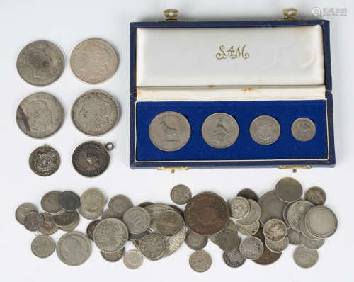 A group of foreign coins, including a Rhodesia four-coin set...