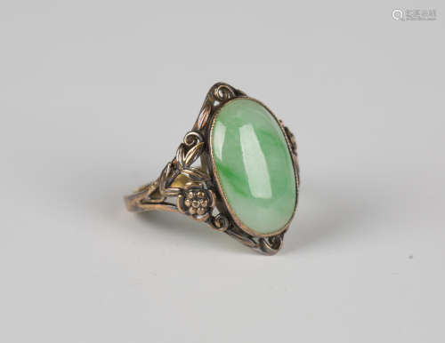 A Bernard Instone gold and jade ring, mounted with an oval j...