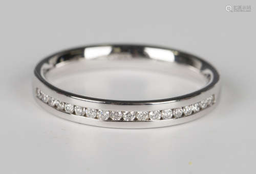 An 18ct white gold and diamond half eternity ring, channel s...