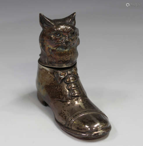 A George V silver novelty inkwell, modelled as a cat in a sh...