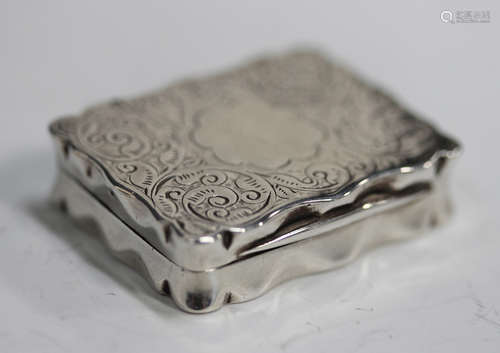 A late Victorian silver vinaigrette of shaped rectangular ou...