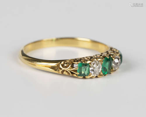 A gold, emerald and diamond five stone ring, mounted with th...