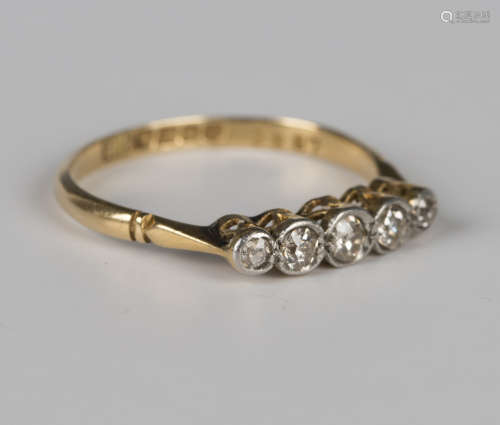An 18ct gold and diamond five stone ring, mounted with a row...
