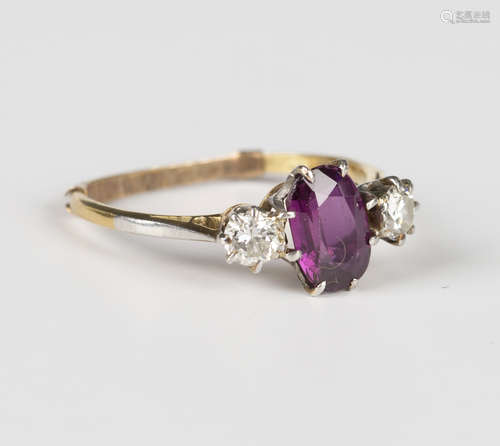 A gold, magenta sapphire and diamond three stone ring, claw ...