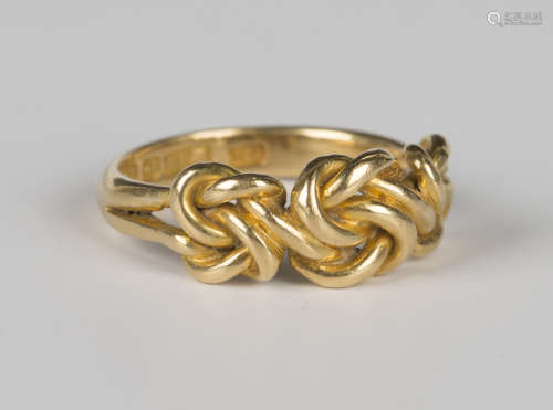 A late Victorian 18ct gold ring in an interwoven design, Bir...