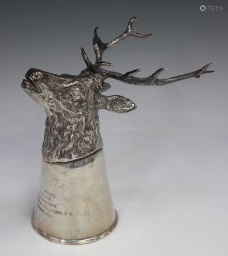 A 20th century German .830 silver stag head stirrup cup with...