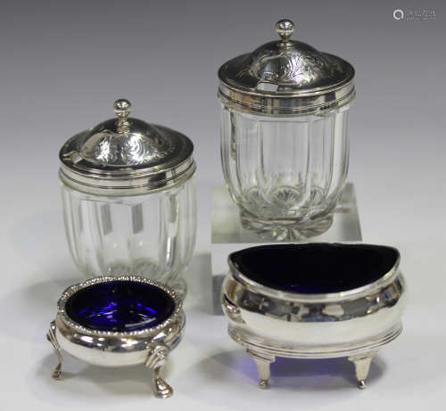 A pair of George III silver mounted cut glass pots, each fac...