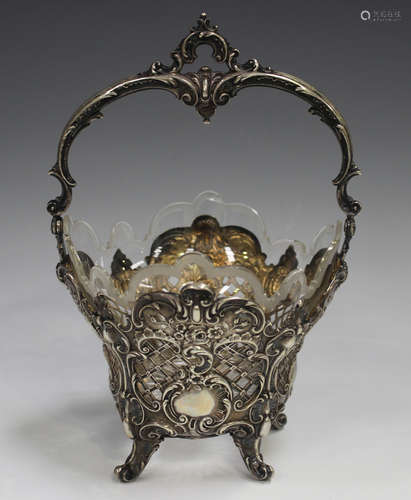 A German .800 silver sugar basket, the overhead scroll swing...