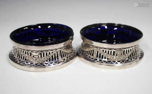 A pair of George V silver diminutive dish rings, each pierce...