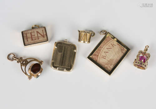 Two 9ct gold charms, each mounted with a ten shillings note,...