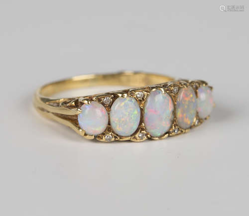 An 18ct gold, opal and diamond ring, mounted with five oval ...