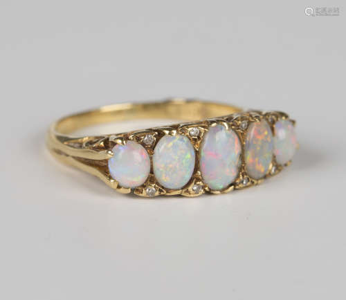 An 18ct gold, opal and diamond ring, mounted with five oval ...