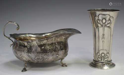 An Art Nouveau silver spill vase, embossed with three vertic...
