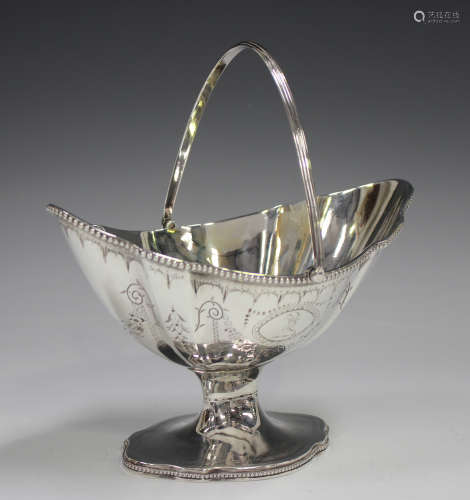 A George III silver basket of boat shaped form with reeded s...