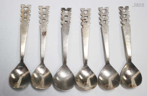 A set of six Art Deco silver spoons, each with fig shaped bo...