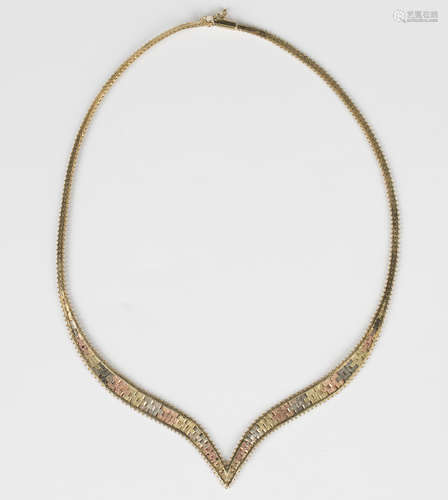 A 9ct three colour gold collar necklace, the front in a 'V' ...