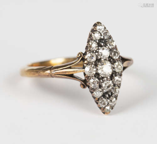 A gold and diamond marquise shaped cluster ring, mounted wit...