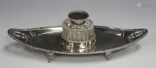 A late Victorian silver boat shaped inkstand with pierced an...